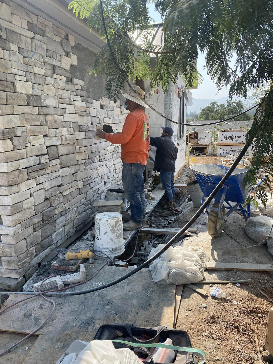 stone-wall-in-construction-with-workers